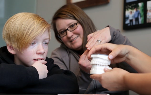 Harmony Orthodontics doctor reviewing a treatment plan with a patient during an initial consultation