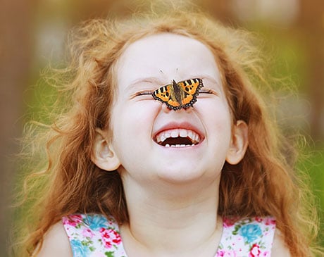 Young child smiling during an early orthodontic visit at Harmony Orthodontics