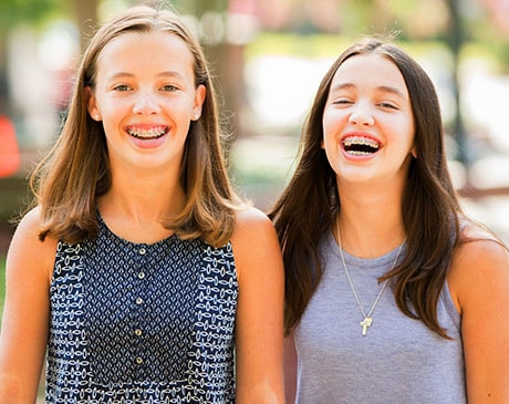 Smiling teenager with braces, a typical Harmony Orthodontics teen patient